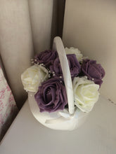 A teardrop bouquet featuring foam roses in your choice of colours