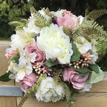 wedding bouquet of dusky pink roses and ivory peonies