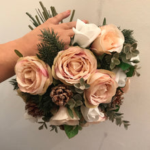 A winter bouquet of white and blush roses