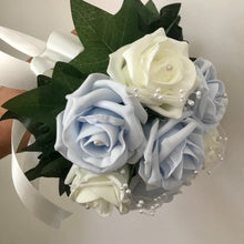 A bouquet collection of artificial baby blue & ivory foam roses with pearl centres
