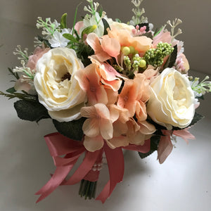A wedding bouquet  collection featuring peach and cream flowers