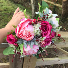 A wedding bouquet of silk pink peony & wine coloured roses