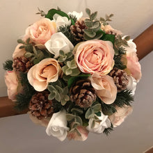 A winter bouquet of white and blush roses