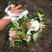 A wedding bouquet of artificial silk ivory & peach roses & hydrangeas