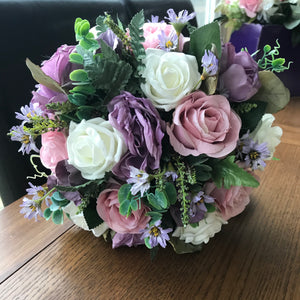 A bridal bouquet of lilac and pink flowers