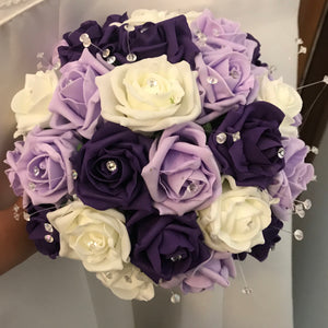 A bouquet collection of artificial purple lilac & ivory foam roses with diamante