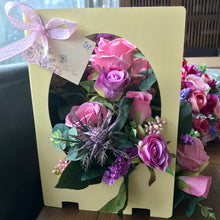 Artificial flowers arranged inside a card
