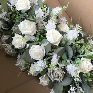 top table flower arrangement in shades of ivory and grey