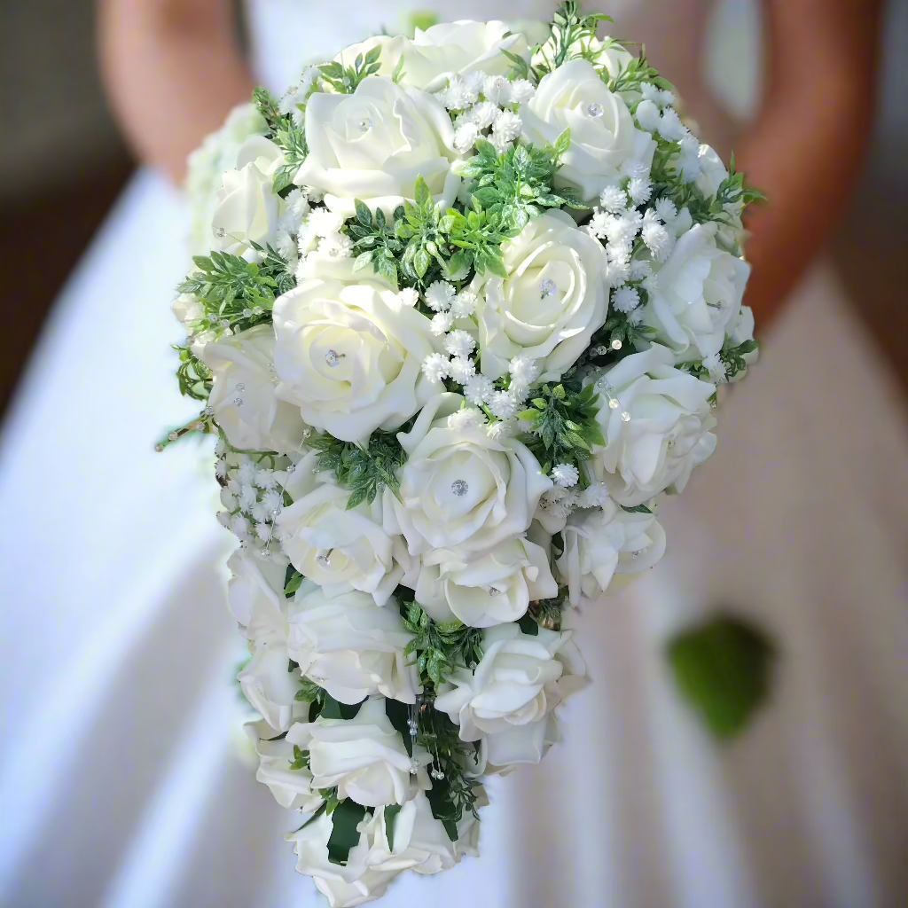 A teardrop bouquet collection of artificial ivory foam roses and gysophila