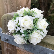 A teardrop bouquet collection of artificial ivory foam roses and gysophila