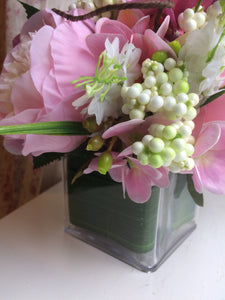 A flower arrangement of pink peonies & hydrangea