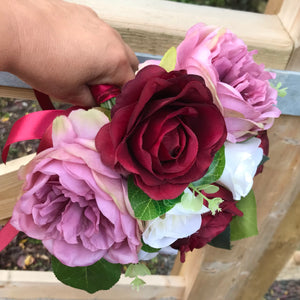 A bouquet of Ivory lilac and burgundy roses