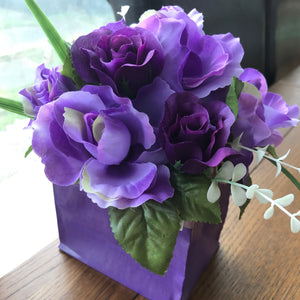purple roses in bouquet box