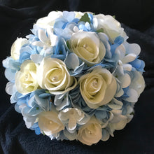 A wedding bouquet collection of blue and ivory or white roses & hydrangea