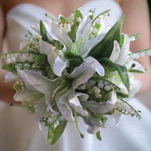 a bouquet of artificial white lilies