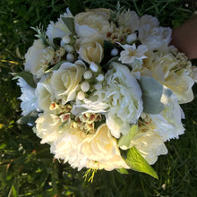 A brides bouquet of lemon and Ivory artificial flowers