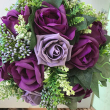A wedding bouquet of purple silk and foam roses