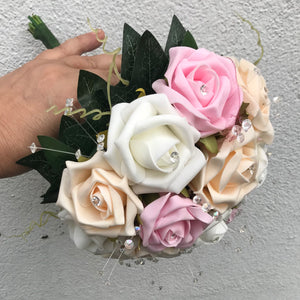 A wedding bouquet of artificial ivory champagne & pink foam Roses