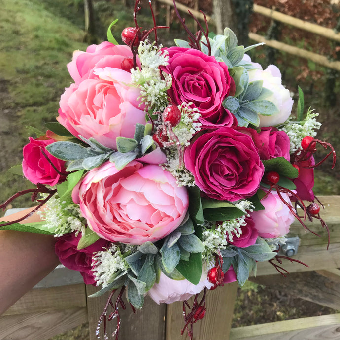 A wedding bouquet of silk pink peony & wine coloured roses