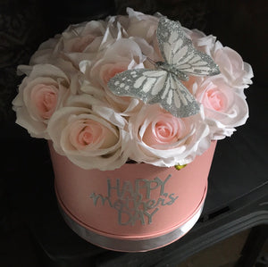 pink roses in hat box
