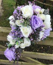 A teardrop bouquet collection of peonies and lilac artificial roses