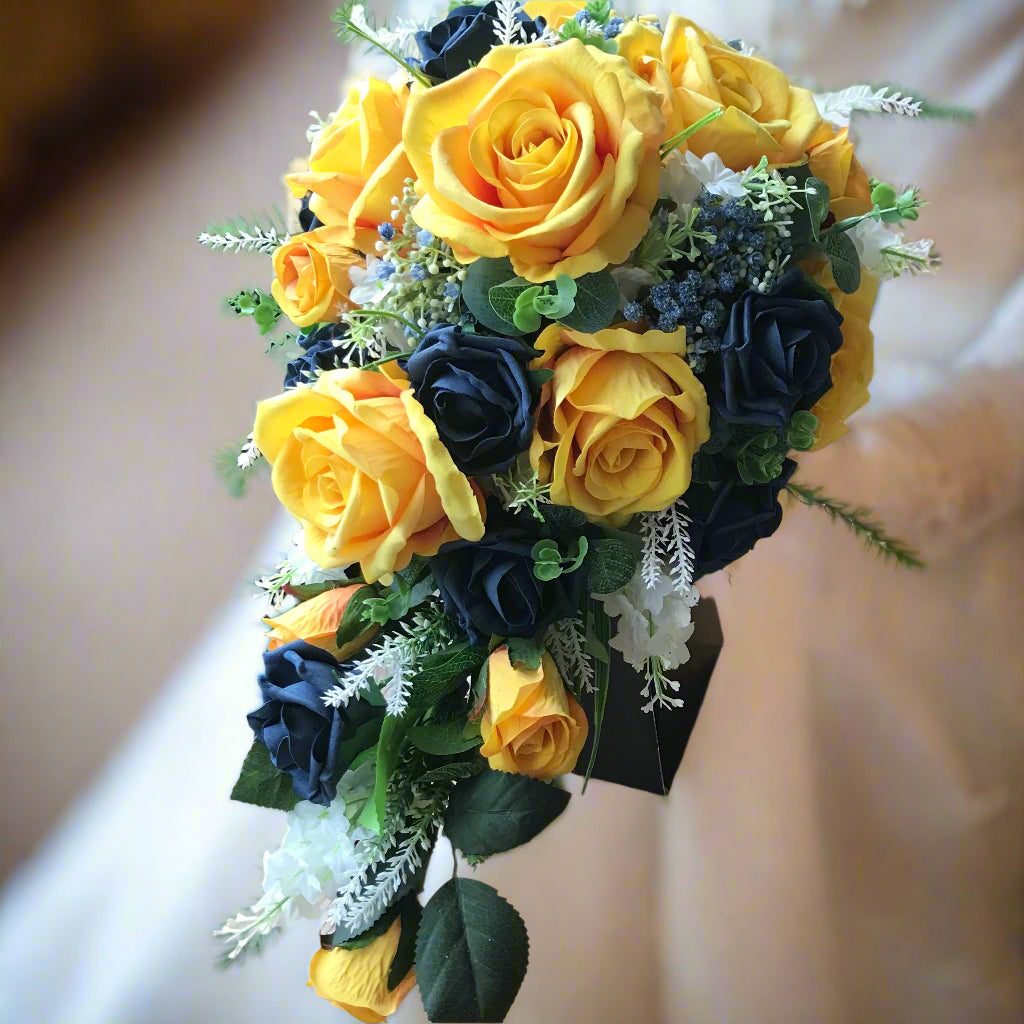 A teardrop bouquet collection of mustard and navy flowers