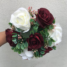 A wedding bouquet of ivory & burgundy silk rose flowers