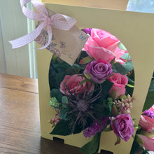 Artificial flowers arranged inside a card