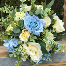 A bridal bouquet in shades of blue and lemon