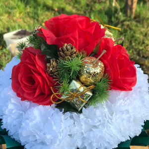 A christmas graveside memorial red and white flower posy