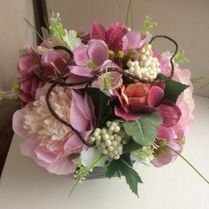 A flower arrangement of pink peonies & hydrangea