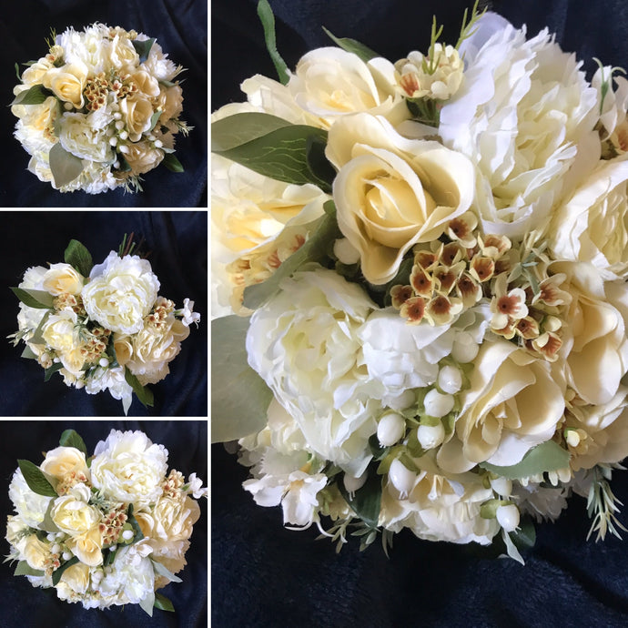 A brides bouquet of lemon and Ivory artificial rose and peony flowers