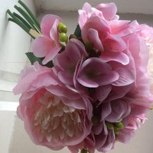 A bunch of faux silk pink hydrangea and peonies