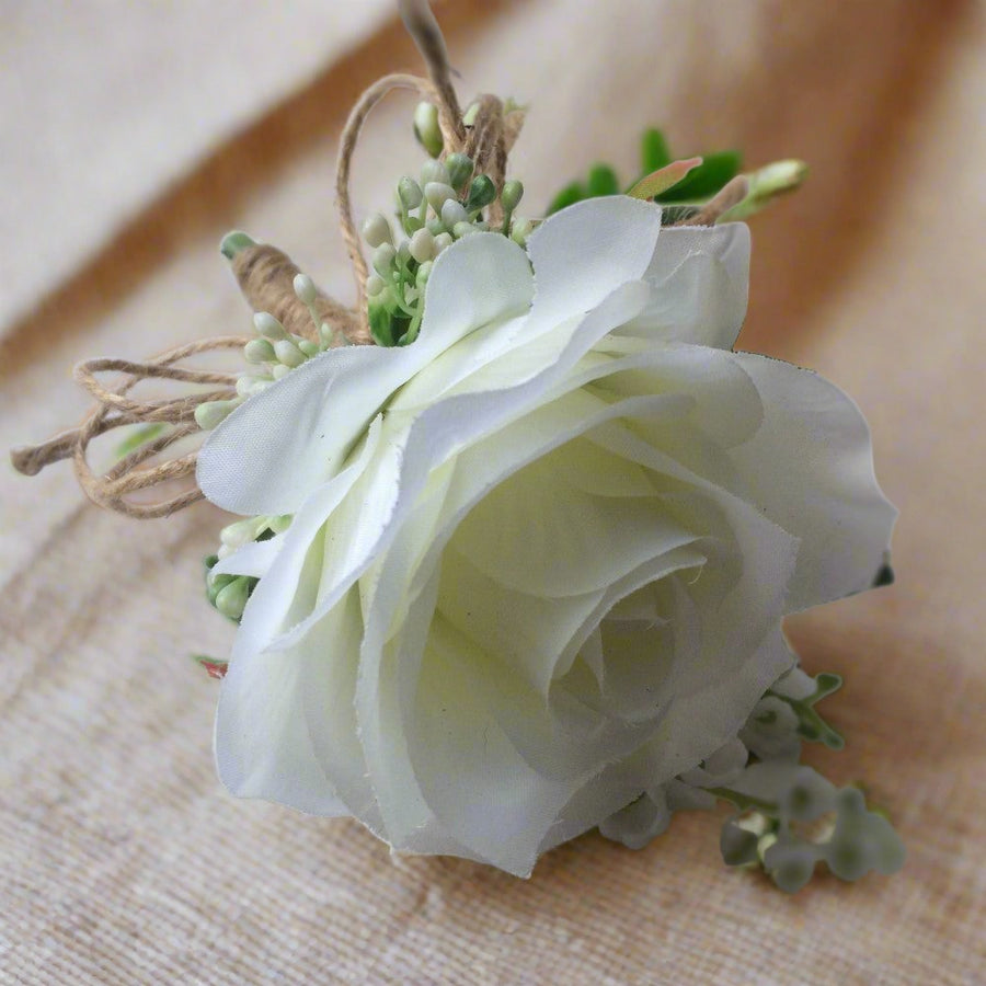 a buttonhole featuring lily of the valley & a white or ivory silk rose ...