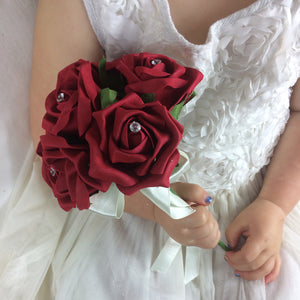 a bridesmaids posy featuring artificial red foam roses with crystal centres