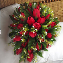 an artificial shower, cascade, teardrop type bouquet featuring red silk tulips